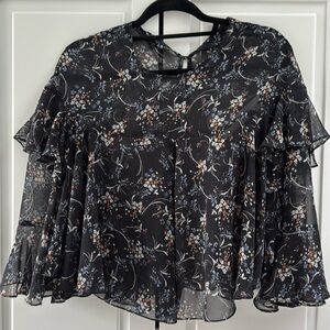 BNWT Zara sheer ruffle top
Black with little blue, brown and white flowers